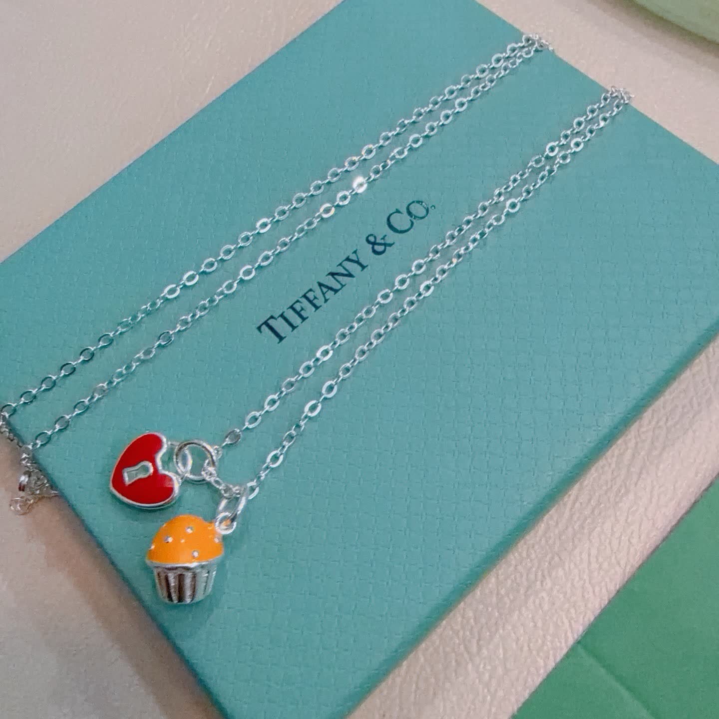 Tiffany & Co. Lock and Key Necklace with Cupcake Charm